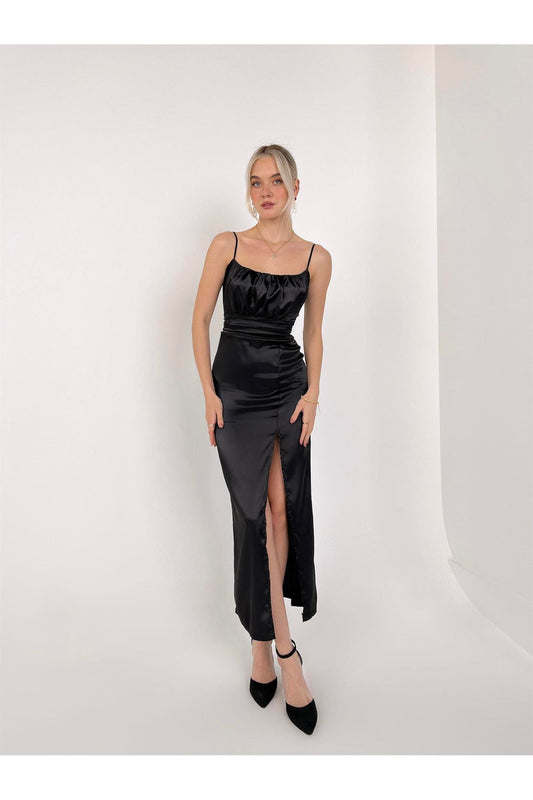 Clad black silky satin slit dress